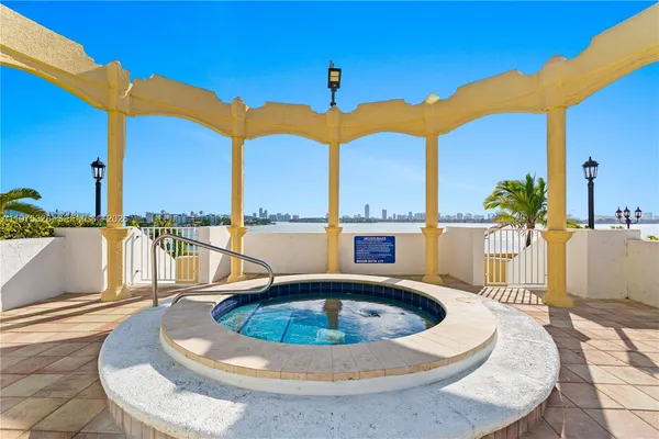a view of a patio with swimming pool