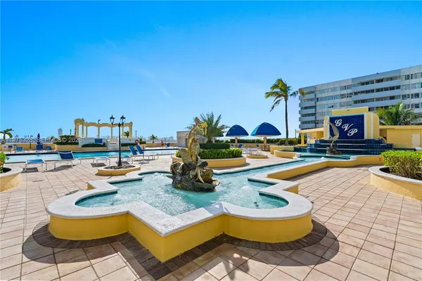 a view of a swimming pool with lounge chairs
