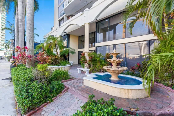 a view of a house with fountain bath tub and chairs