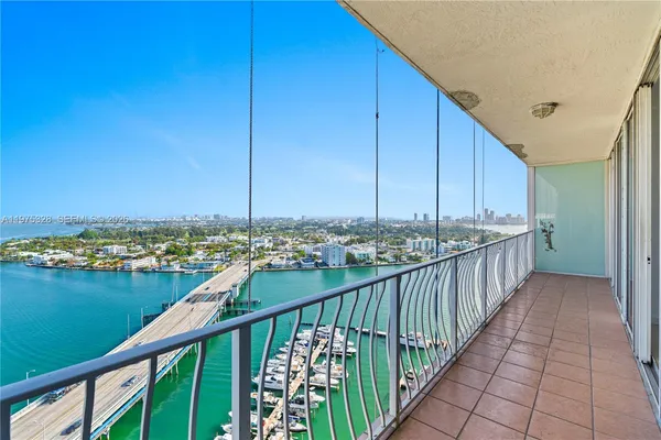 a view of a balcony with city