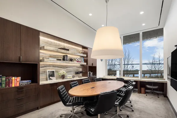 a living room with furniture and a lamp
