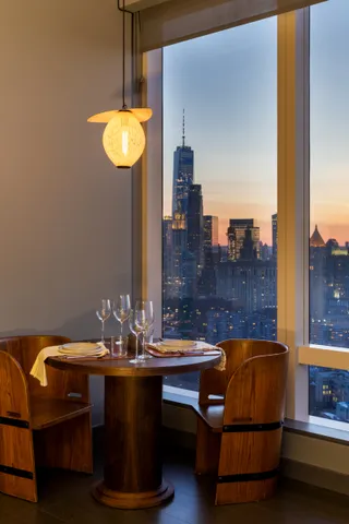 a living room with furniture and a lamp