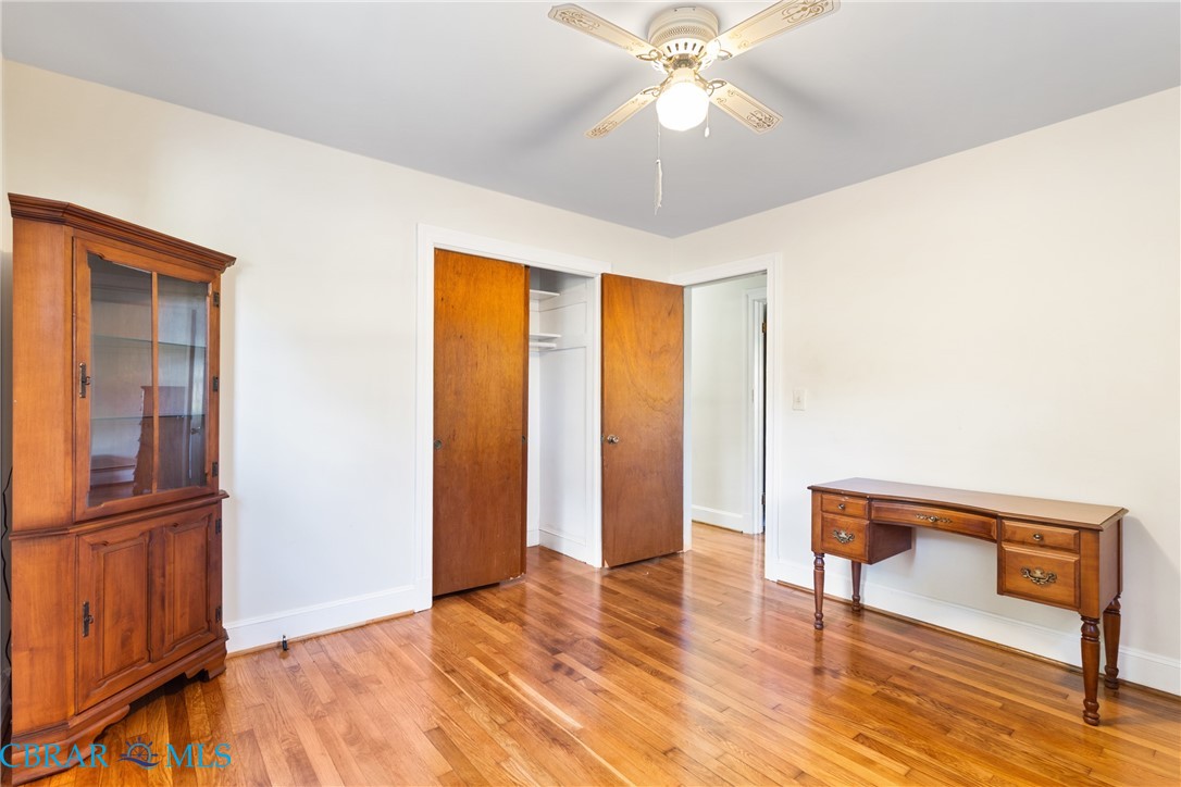 275 Waverly Road Urbanna, VA 23175 - Photo 19 of 27 Bedroom featuring light wood-type flooring, a closet, and ceiling fan