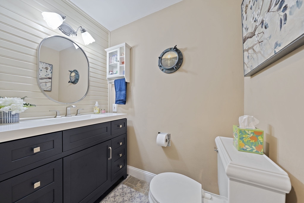 16 Jay Road Weymouth, MA 02190 - Photo 15 of 40 a bathroom with a granite countertop toilet sink and mirror