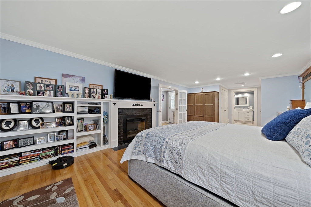 16 Jay Road Weymouth, MA 02190 - Photo 18 of 40 a bedroom with a bed a dresser and a book shelf