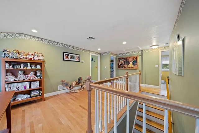 a view of a hallway with furniture
