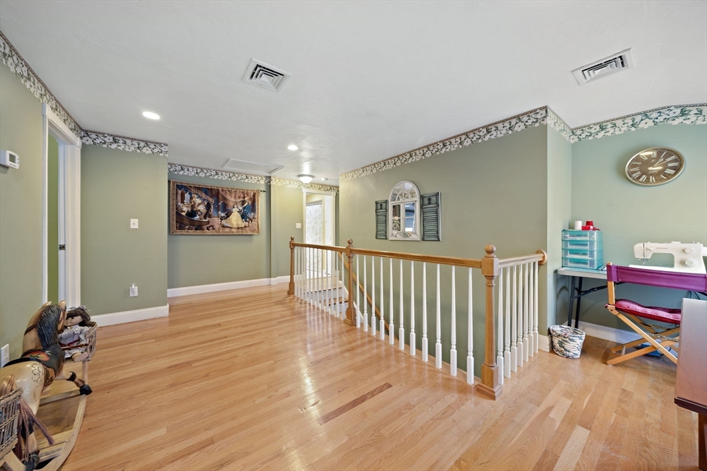16 Jay Road Weymouth, MA 02190 - Photo 22 of 40 a view of a hallway with workspace and wooden floor