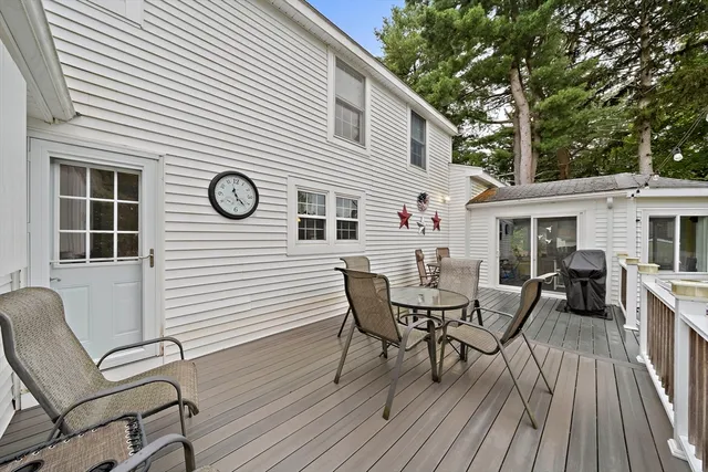 a view of a house with a patio and a dining space