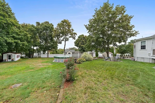 a view of a tree in front of a house