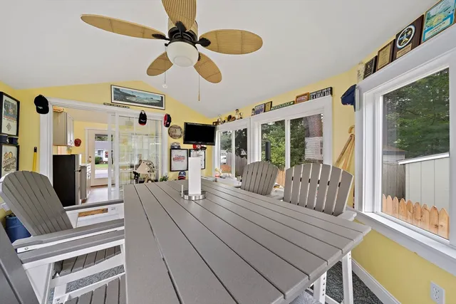 a view of a dining room with furniture wooden floor and chandelier