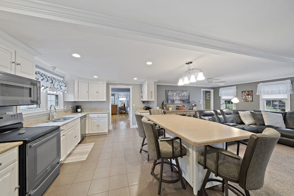 16 Jay Road Weymouth, MA 02190 - Photo 8 of 40 a large kitchen with a table and chairs