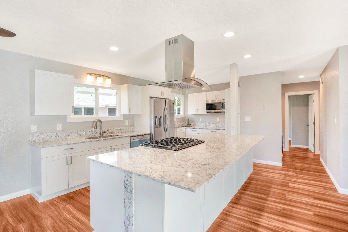 4923 Aliali Road, Unit 14 Kapaa, HI 96746 - Photo 8 of 30 a kitchen with stainless steel appliances granite countertop a sink and a refrigerator
