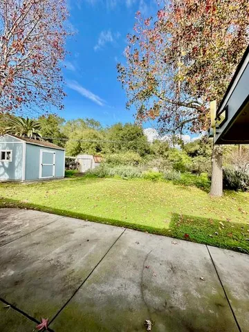 a view of a yard with an outdoor space