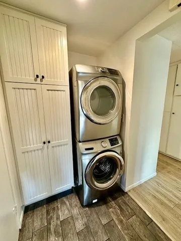 a view of a hallway with washer and dryer