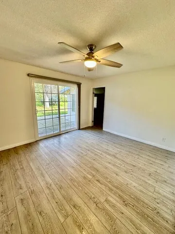 a view of an empty room with glass door