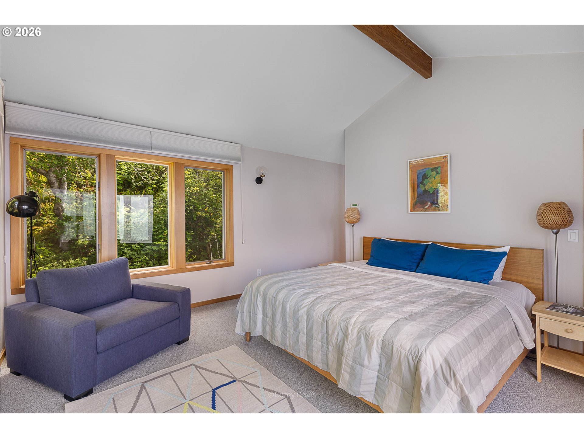 38295 Beulah Reed Road Nehalem, OR 97131 - Photo 32 of 42 a bedroom with a bed and a large window