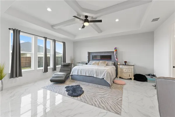a bedroom with a bed and glass door
