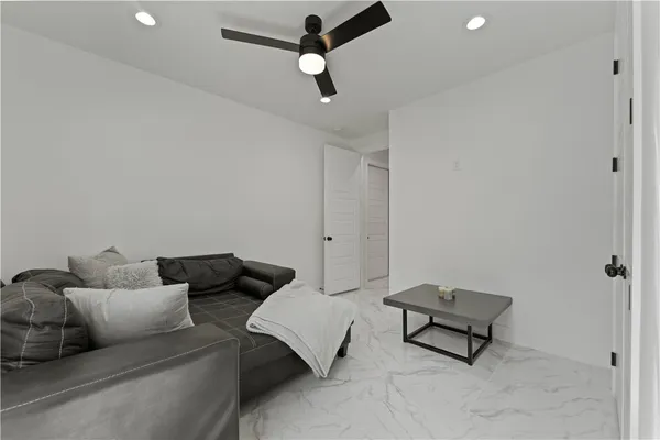 a living room with furniture and a rug
