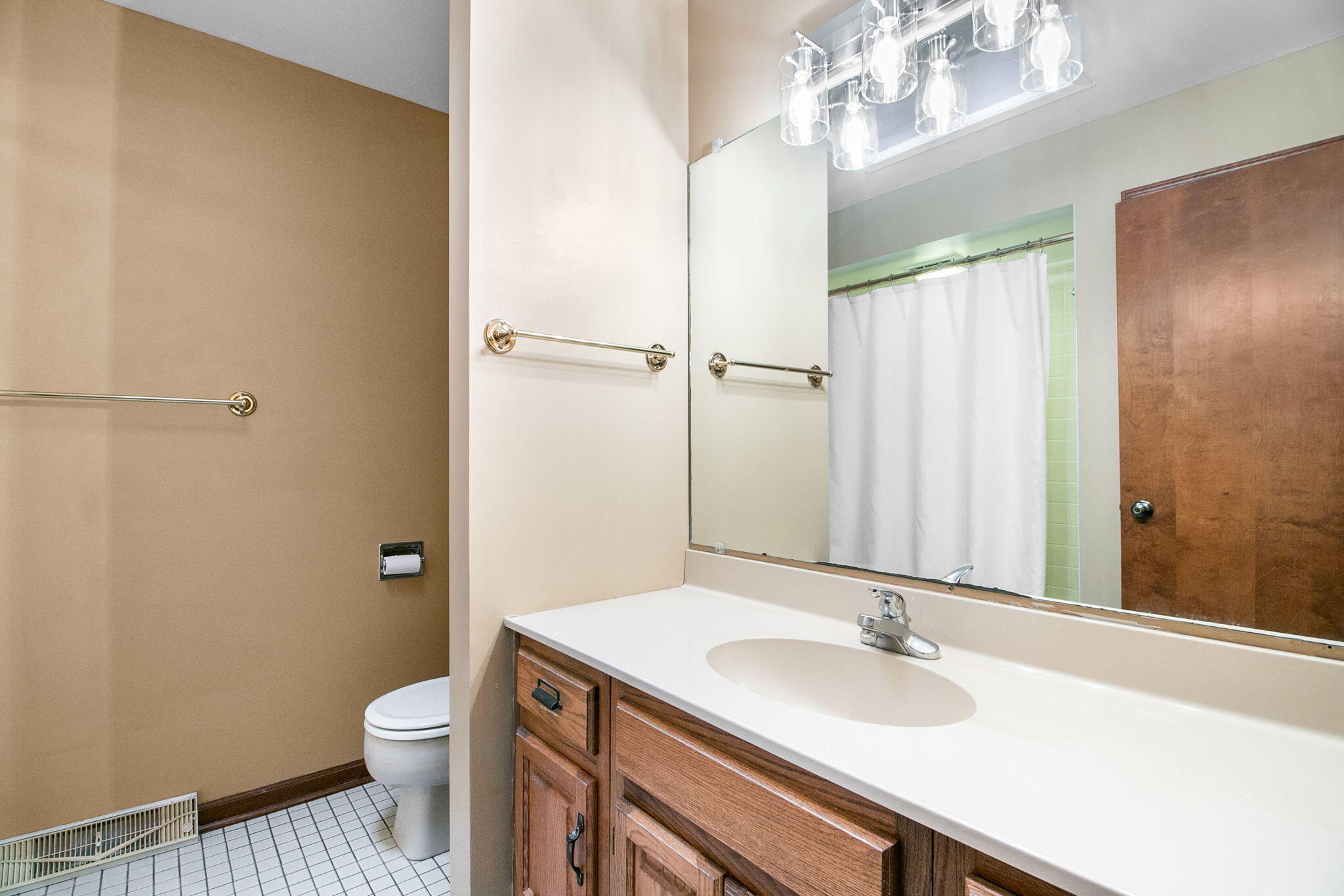 1121 Cheyenne Drive Crown Point, IN 46307 - Photo 13 of 18 a bathroom with a granite countertop sink toilet and shower