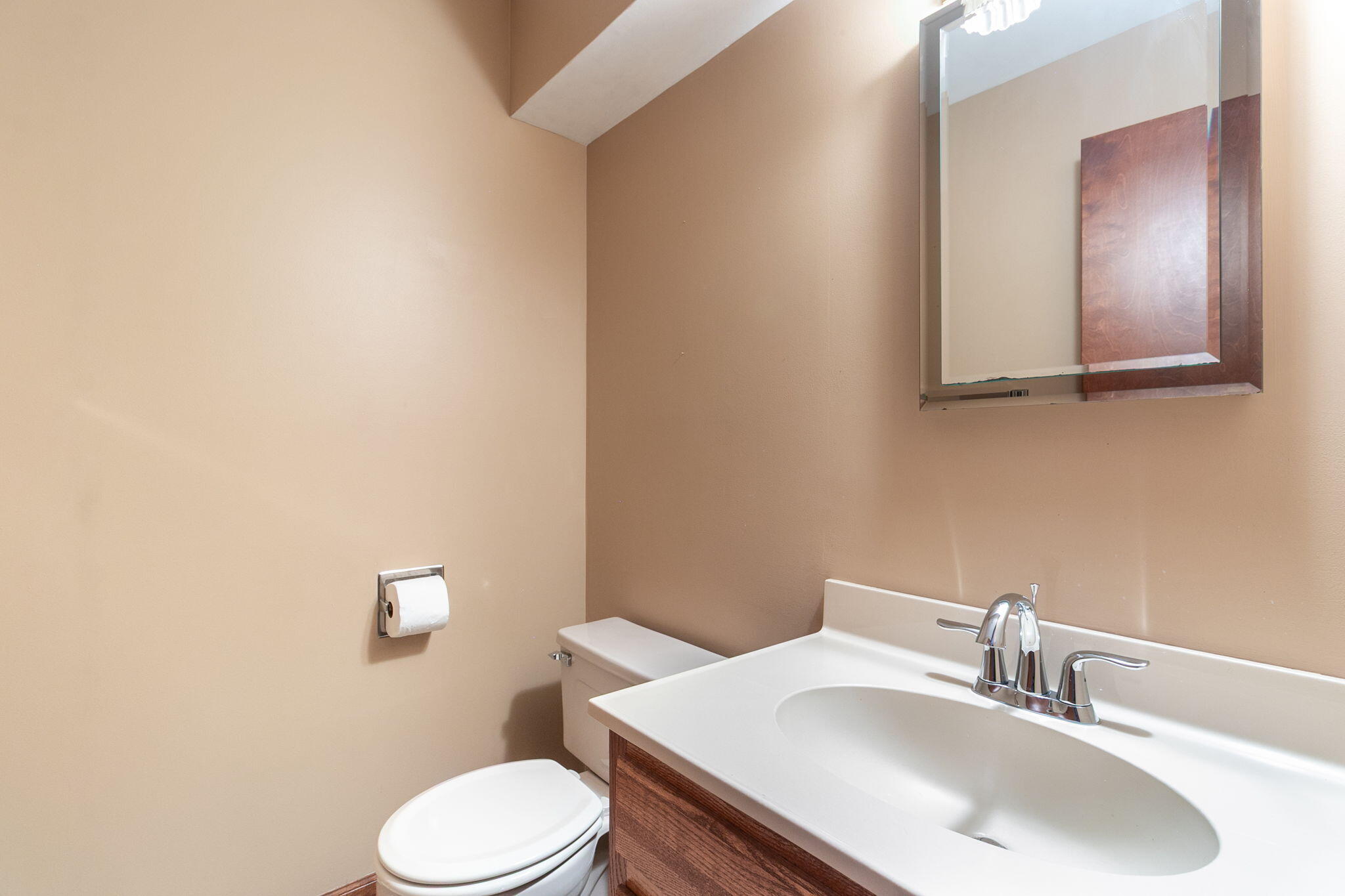 1121 Cheyenne Drive Crown Point, IN 46307 - Photo 5 of 18 a bathroom with a sink a toilet and mirror