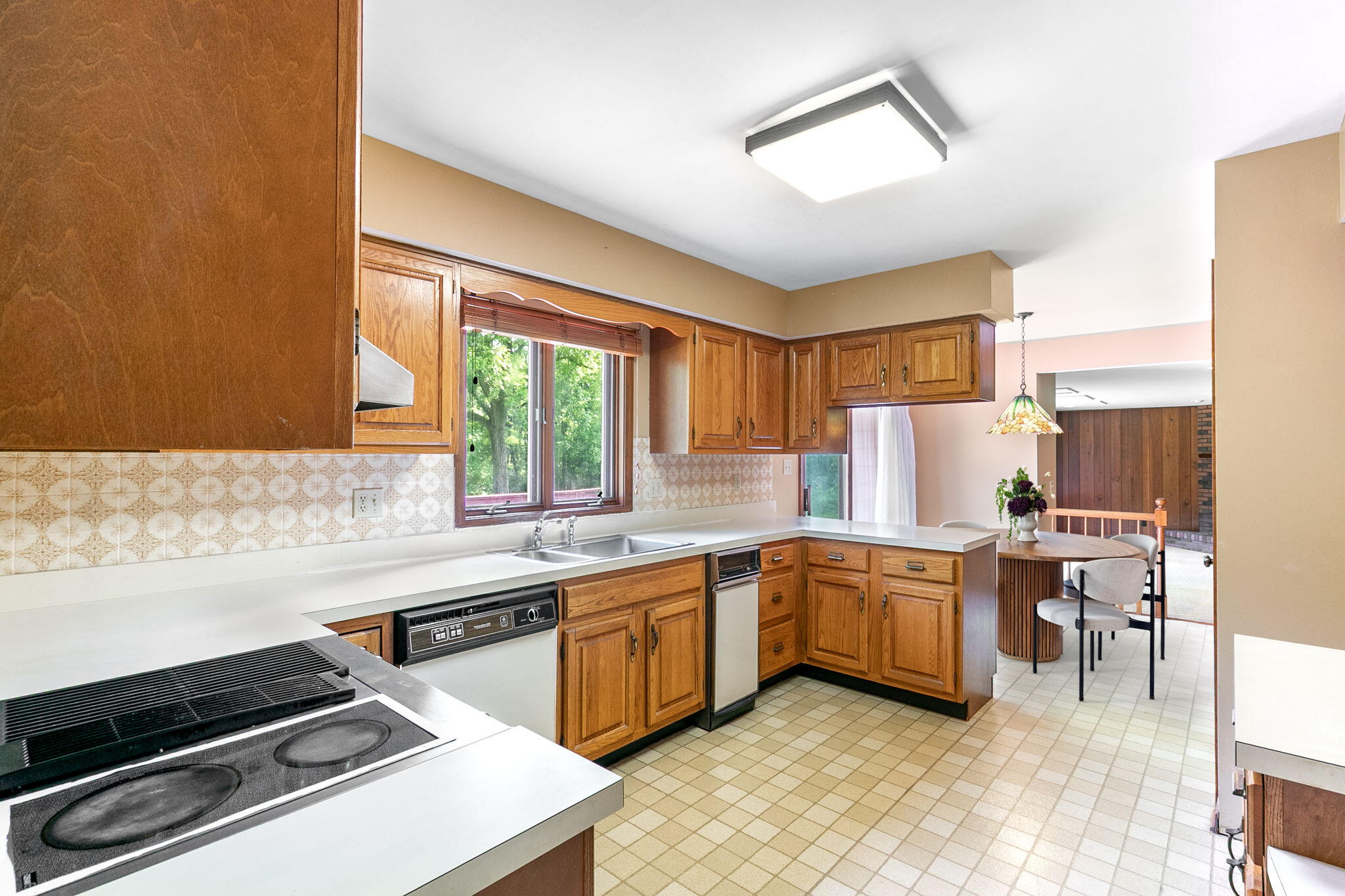 1121 Cheyenne Drive Crown Point, IN 46307 - Photo 7 of 18 a kitchen with a stove a sink and a refrigerator