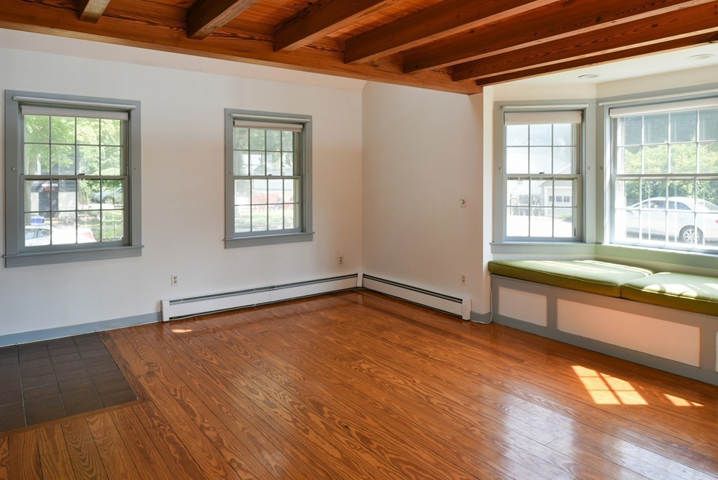 2 Knollwood Road Marblehead, MA 01945 - Photo 7 of 30 a view of an empty room with wooden floor and a window