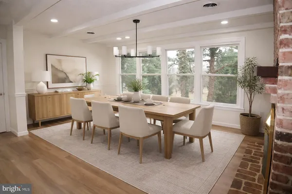 a kitchen with granite countertop a stove fireplace and a wooden floor