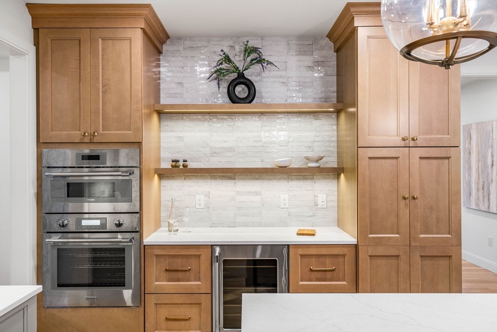 59 Dexter Road Melrose, MA 02176 - Photo 13 of 41 a kitchen with a refrigerator and cabinets