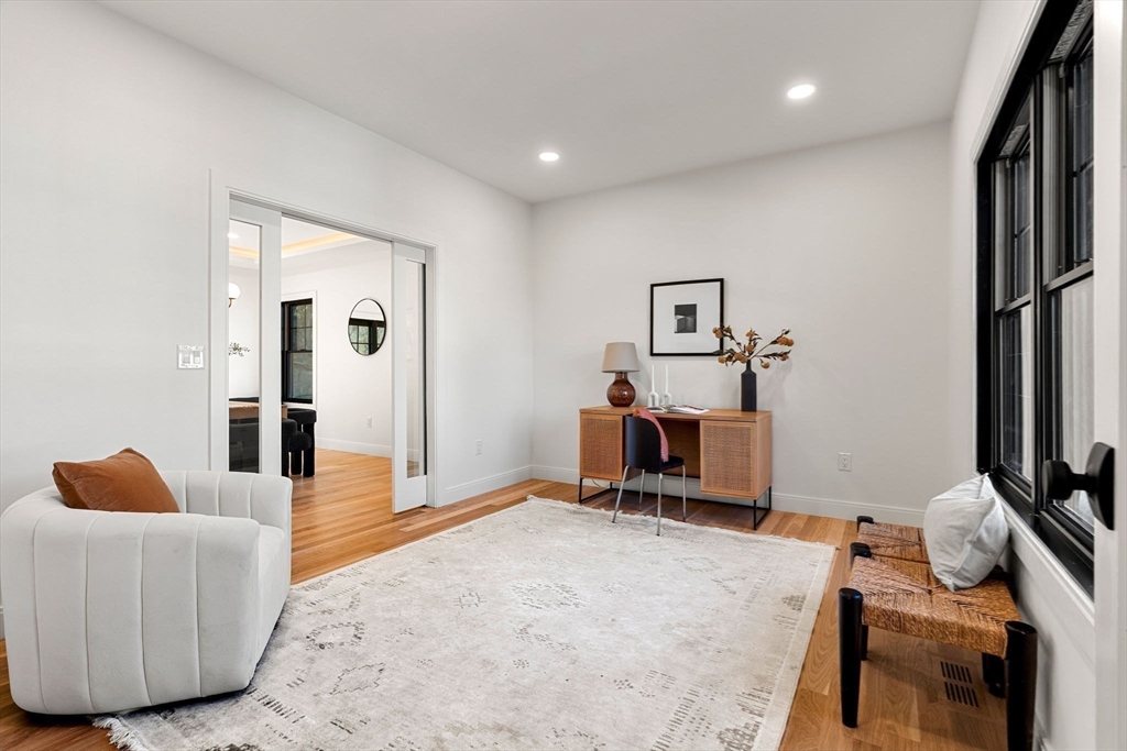 59 Dexter Road Melrose, MA 02176 - Photo 22 of 41 a living room with furniture and a flat screen tv