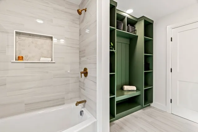 a bedroom with a bed and glass windows