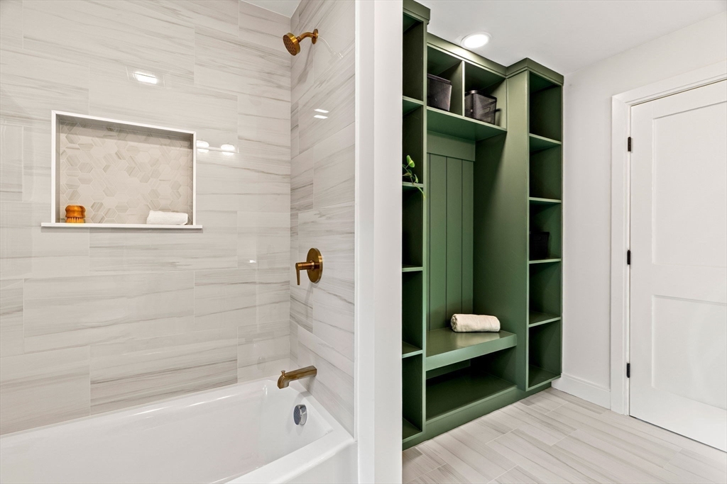 59 Dexter Road Melrose, MA 02176 - Photo 26 of 41 a bathroom with a bathtub and a shower