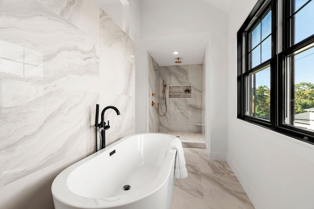 59 Dexter Road Melrose, MA 02176 - Photo 30 of 41 a bathroom with a bathtub and a sink