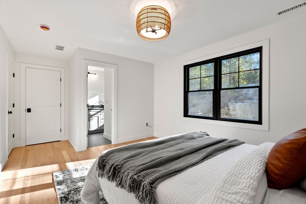 59 Dexter Road Melrose, MA 02176 - Photo 33 of 41 a bedroom with a bed and a window