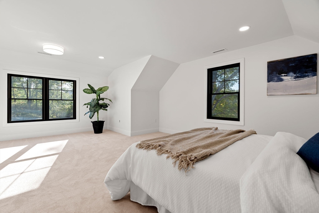 59 Dexter Road Melrose, MA 02176 - Photo 35 of 41 a bedroom with a bed and a large window