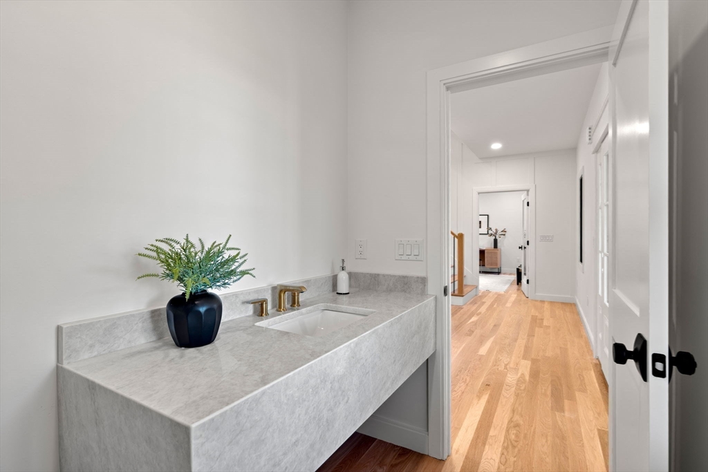 59 Dexter Road Melrose, MA 02176 - Photo 37 of 41 a dining room with furniture and potted plant