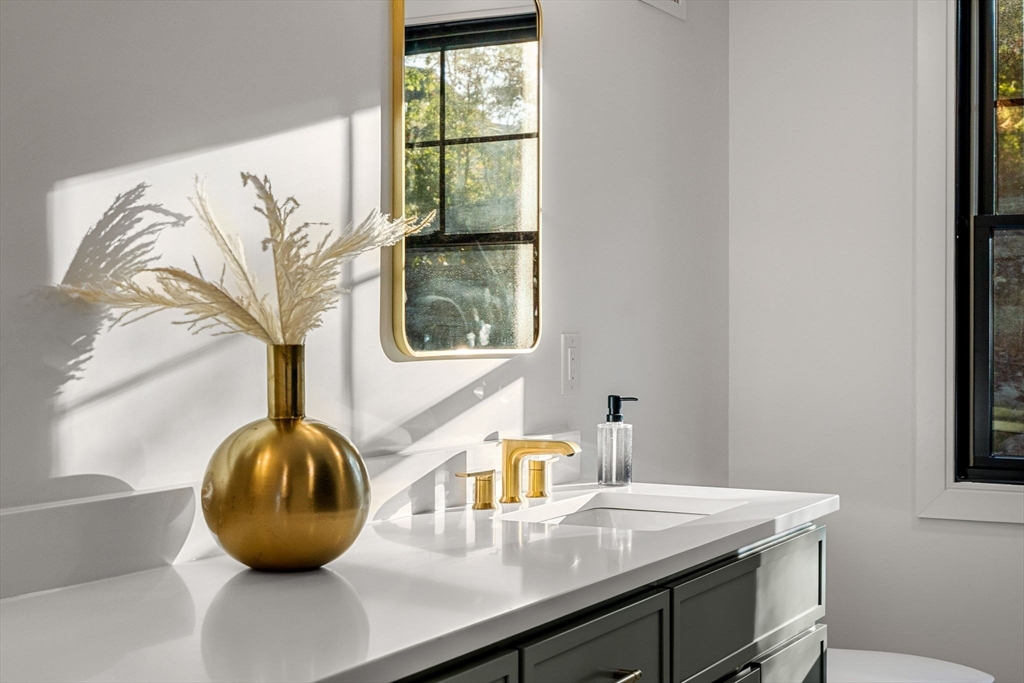 59 Dexter Road Melrose, MA 02176 - Photo 40 of 41 a view of a bathroom with a sink and mirror