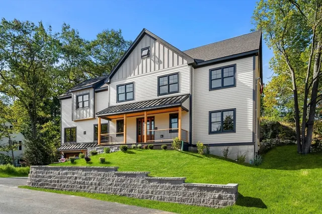 a view of a house with backyard and sitting area