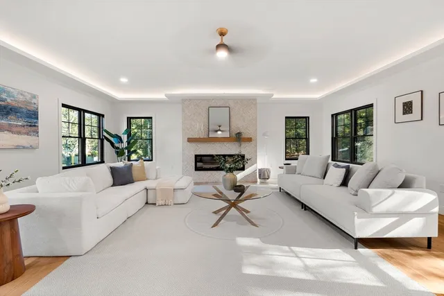 a living room with furniture and a large window
