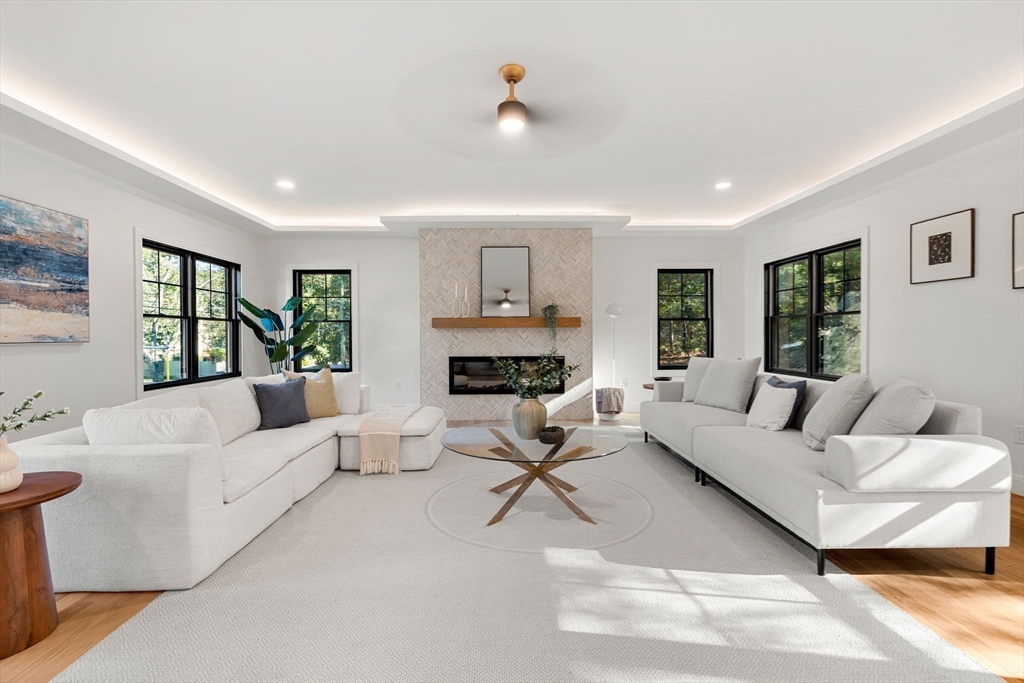 59 Dexter Road Melrose, MA 02176 - Photo 7 of 41 a living room with furniture and a fireplace