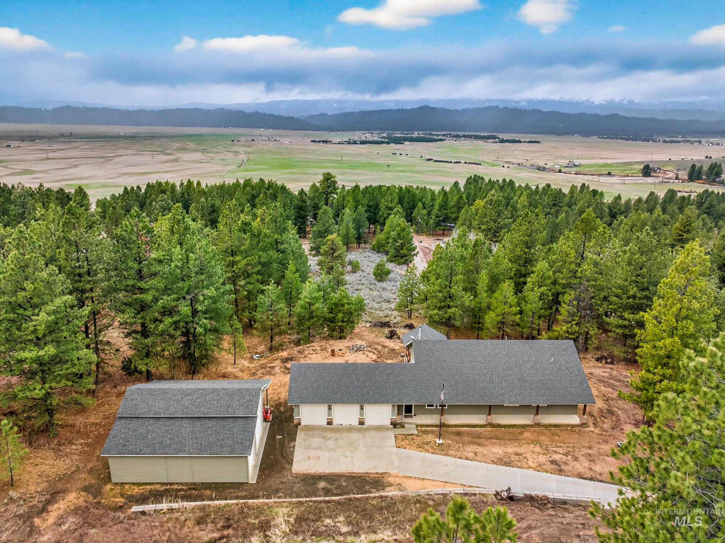 10191 Timberrim Drive Cascade, ID 83611 - Photo 38 of 44 View from above of property with a mountain backdrop
