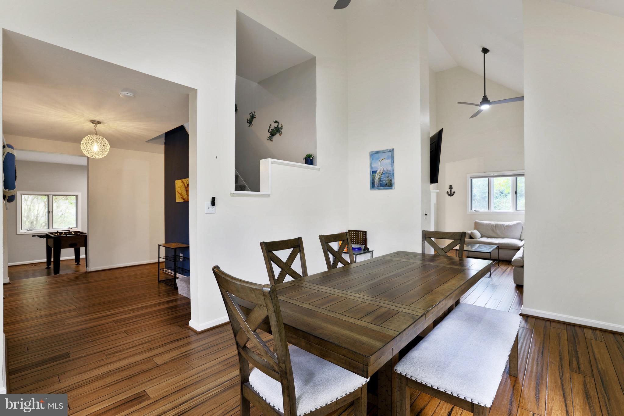 920 Old Annapolis Neck Road Annapolis, MD 21403 - Photo 11 of 58 a view of a dining room with furniture and wooden floor
