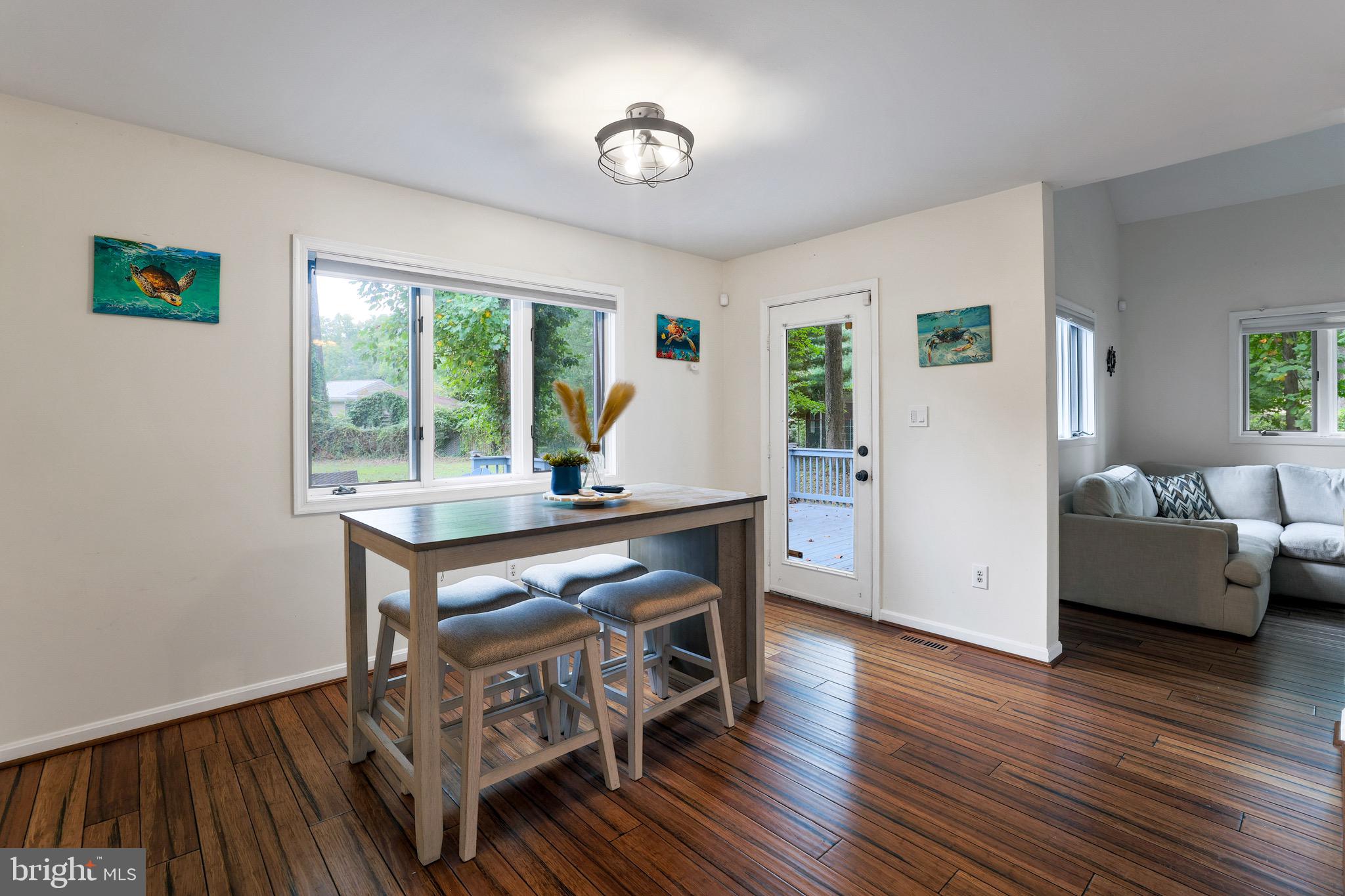 920 Old Annapolis Neck Road Annapolis, MD 21403 - Photo 15 of 58 a view of a workspace with furniture and a wooden floor