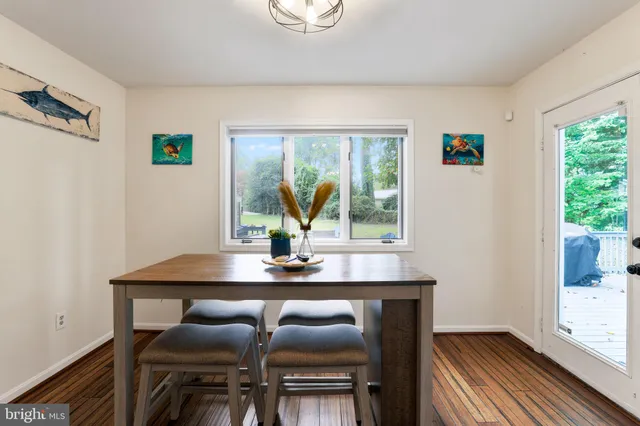 a kitchen with stainless steel appliances kitchen island granite countertop a refrigerator and a sink