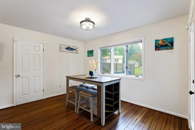 a kitchen with stainless steel appliances granite countertop wooden cabinets stove top oven and sink