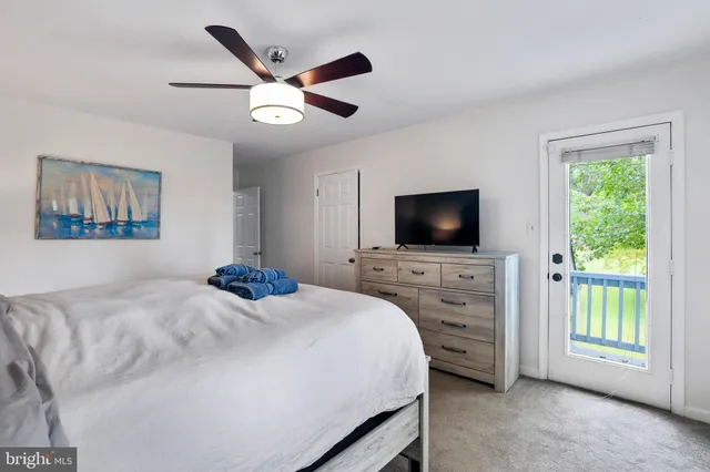 a view of a bedroom from a hallway