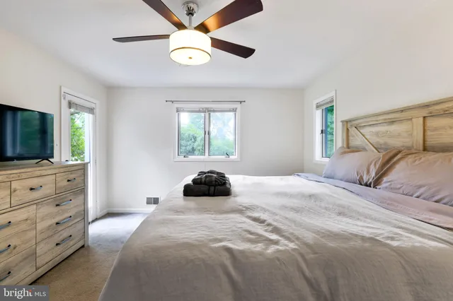 a bedroom with furniture and a gate