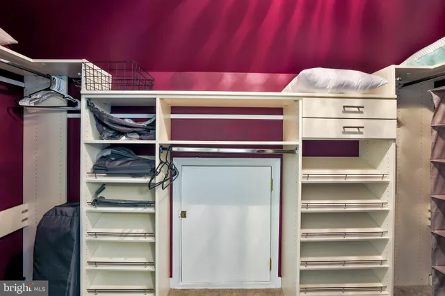 a bed room with a bed and a desk