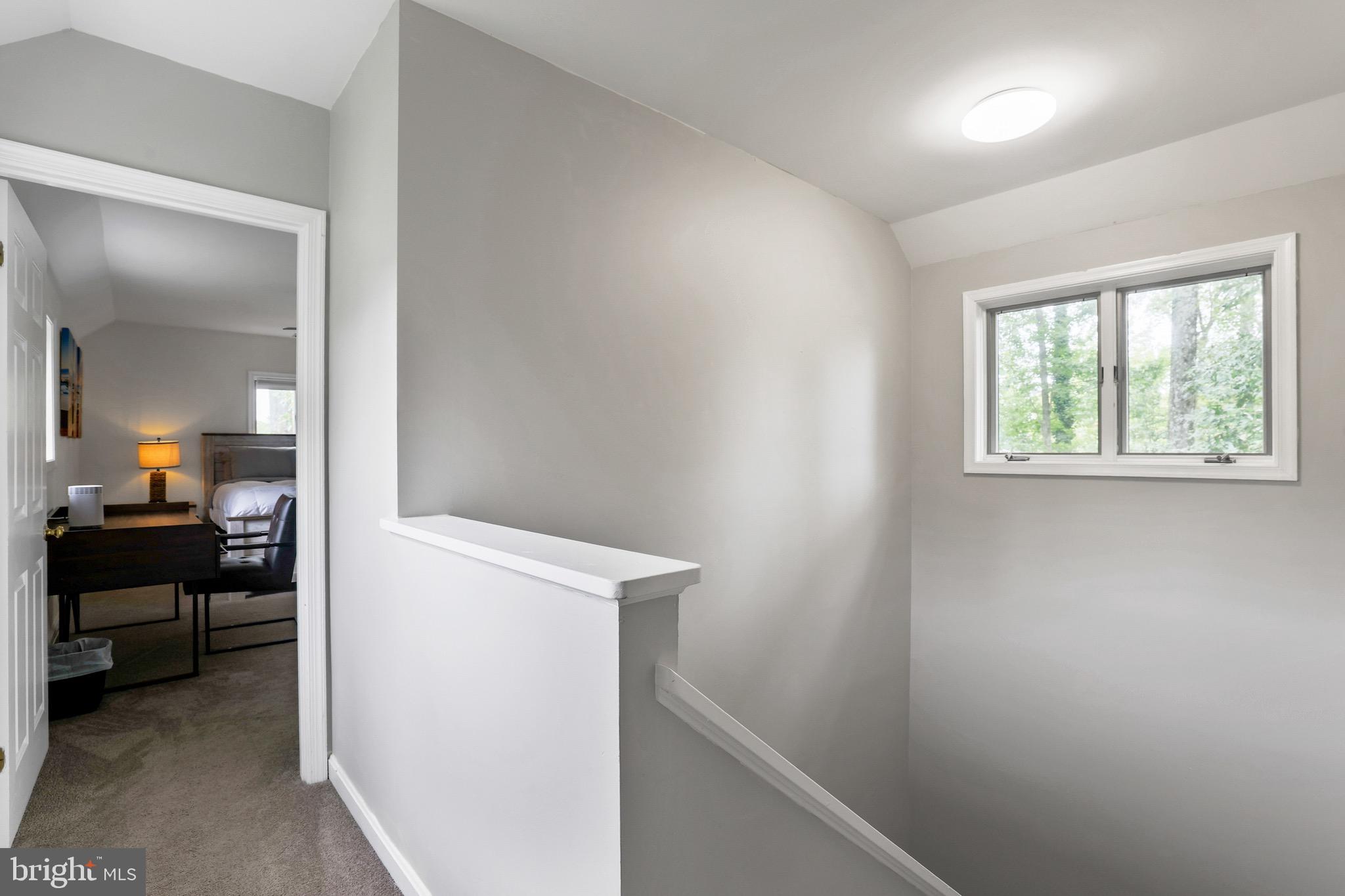 920 Old Annapolis Neck Road Annapolis, MD 21403 - Photo 33 of 58 a view of a bedroom from a hallway