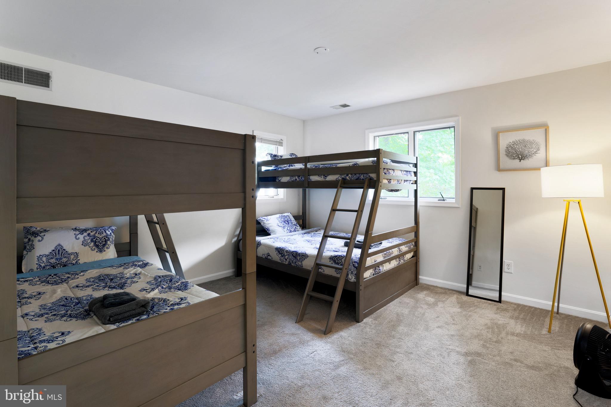 920 Old Annapolis Neck Road Annapolis, MD 21403 - Photo 37 of 58 a bedroom with furniture and a gate