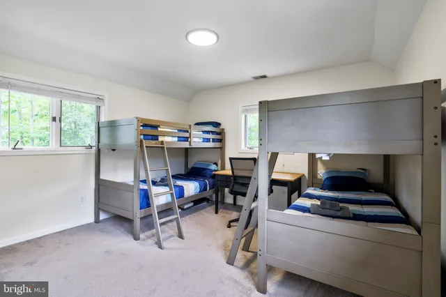 a view of a chair and table in the patio